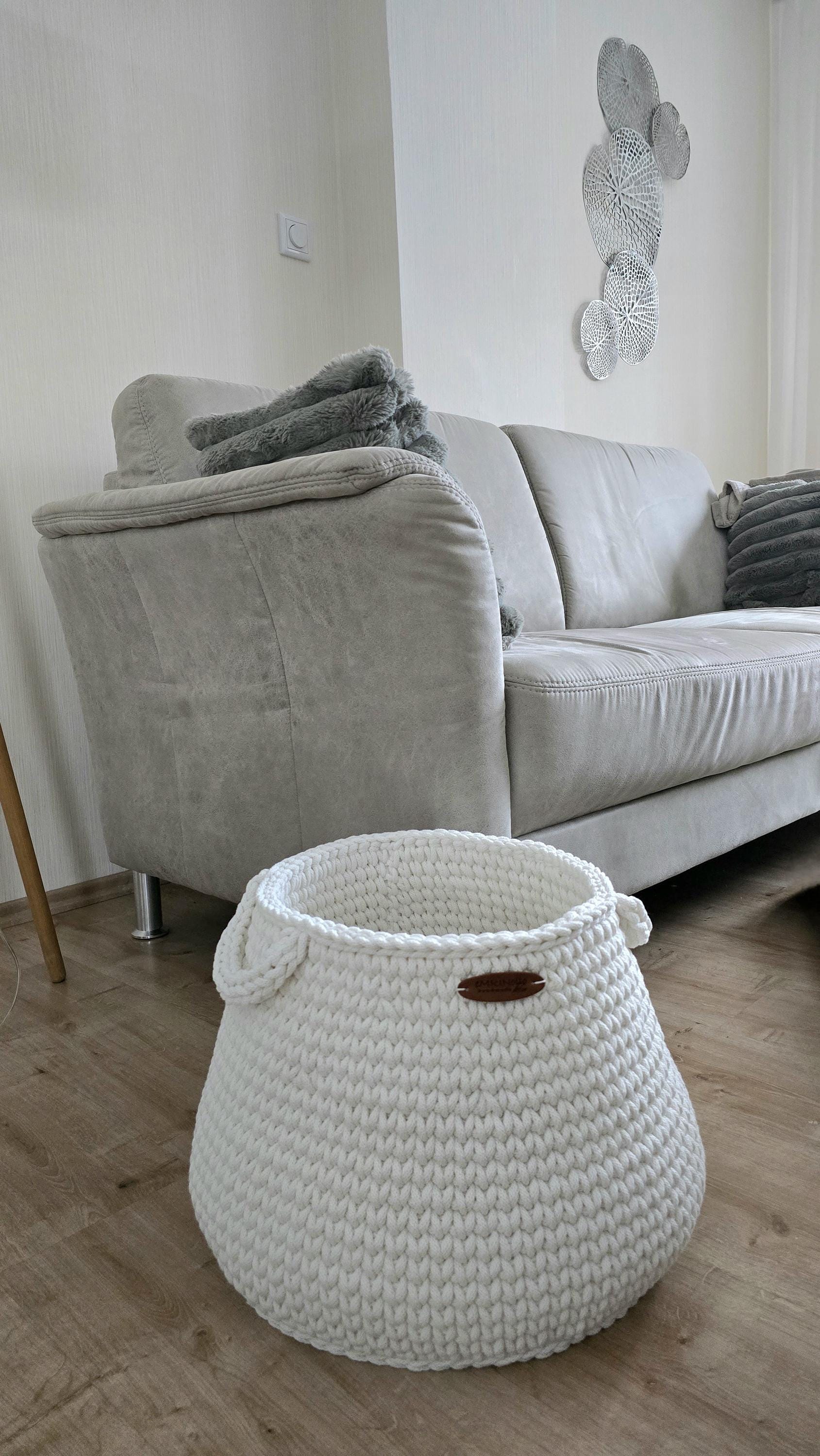 Large textile floor basket as calm storage solution in the living room